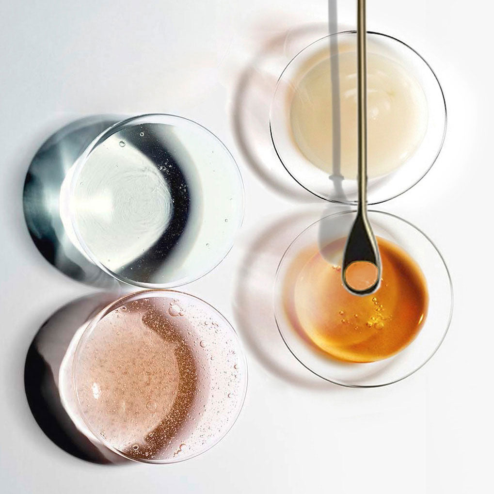 Boustise Bust and Bum Enhancement Quadraplump volume enhancing extracts on lab glass
